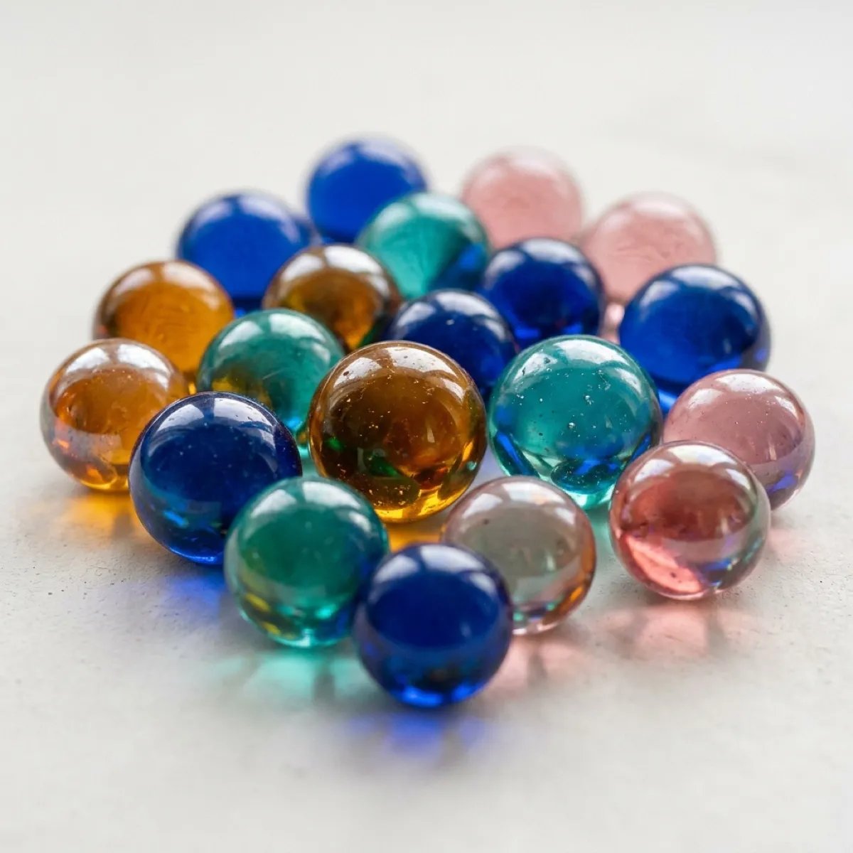 Coloured glass orbs on a pale surface